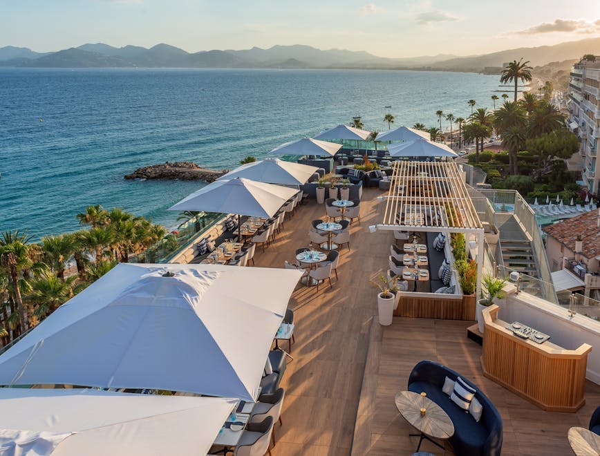 hotel resort plant desk waterfront handbag outdoors swimming pool car scenery